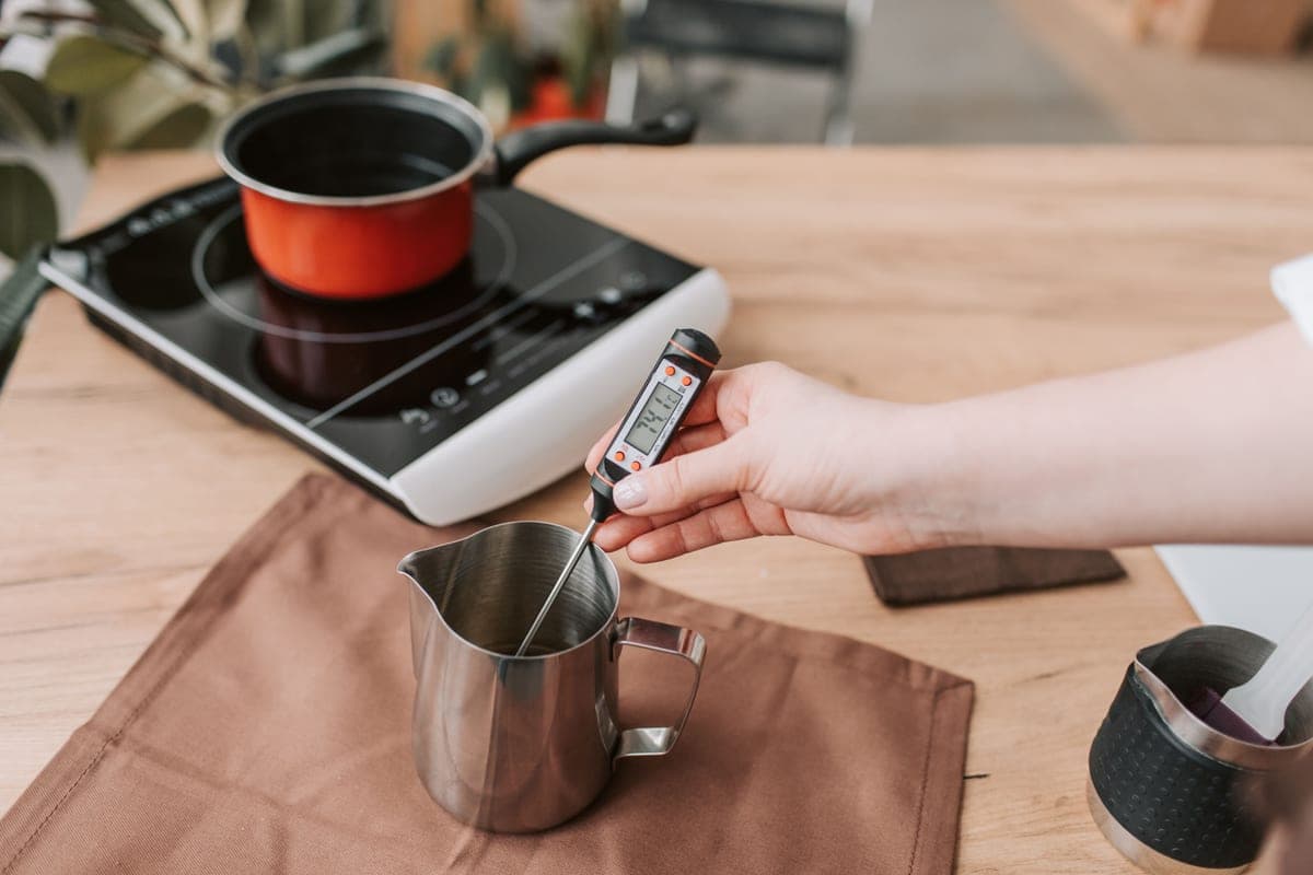 Taking the temperature of a hot cooking surface